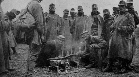 Troops in Gallipoli at Christmas 1914, standing around in there winter coats.