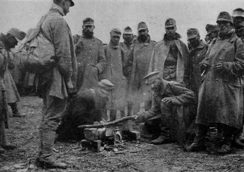 Troops in Gallipoli at Christmas 1914, standing around in there winter coats.