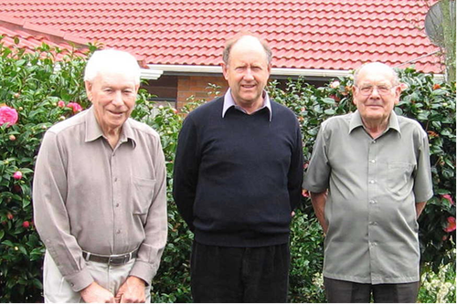 Photograph of three men.