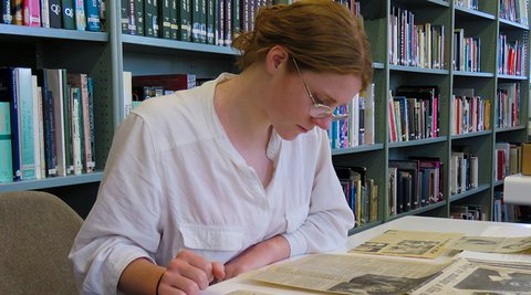 Caitlin Lynch in the Jonathan Dennis Library