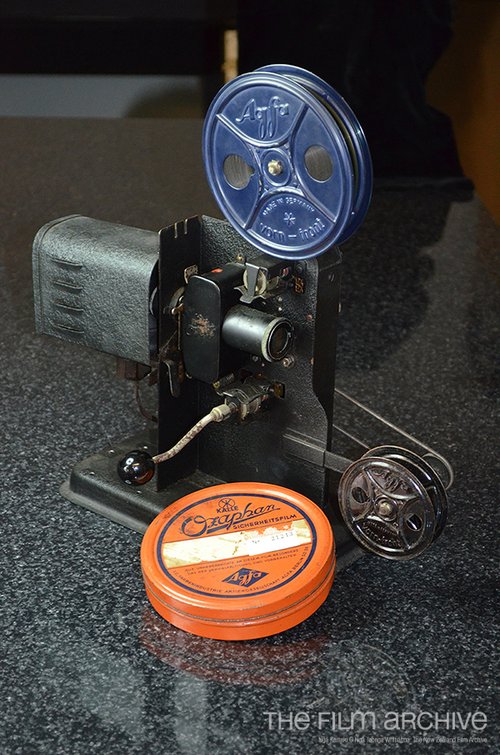 16mm toy projector, with a can of Ozaphan film.