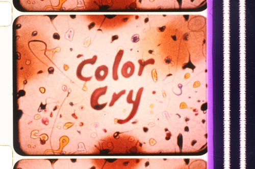 A close-up of a film frame with the text 'Colour Cry'.