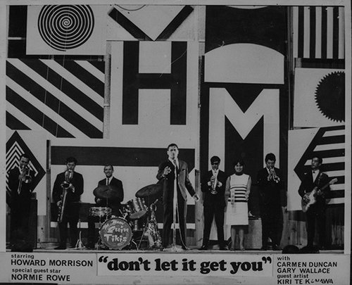 Poster for the film 'Don't Let It Get You', with an image of a band on stage.