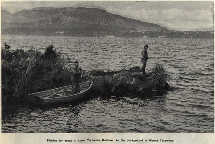 Two men fishing on a lakeside.