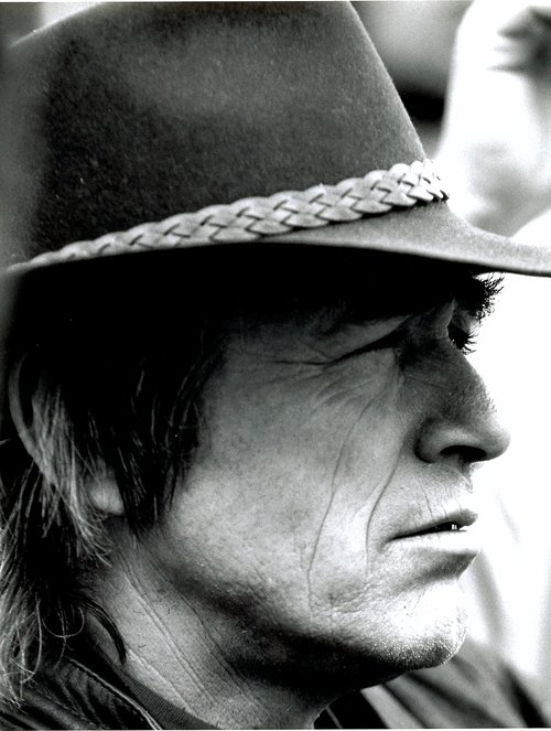 Profile image of man in hat.