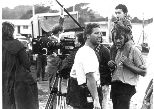 Men and child on film set.