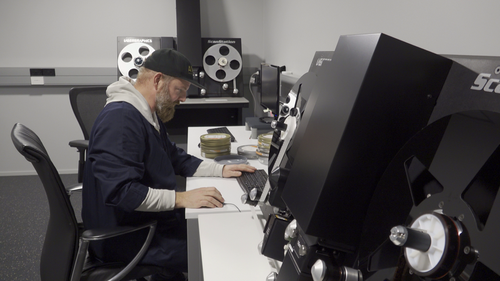 Film Preservationist Richard Falkner working on a film.