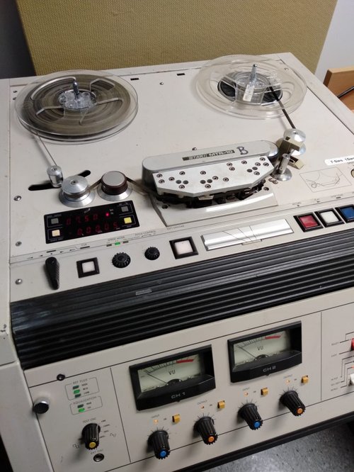 Paper-based tape running through the reel-to-reel machine.