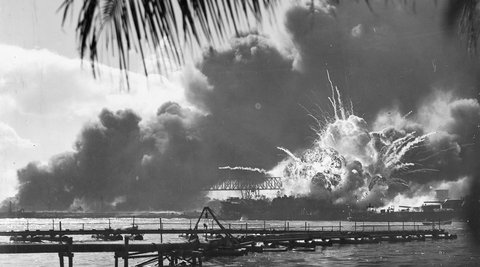 An explosion on a beach during the attack on Pearl Harbour.