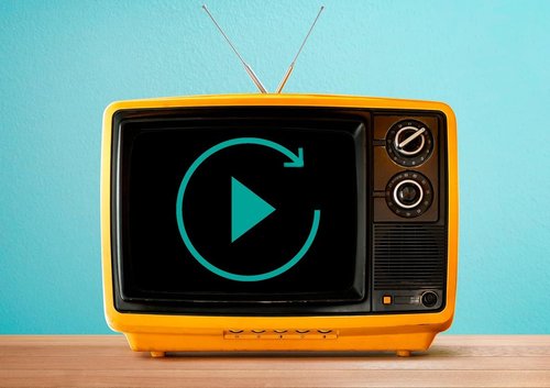 An aerial atop a small yellow TV with a 'play video' icon showing on the screen.