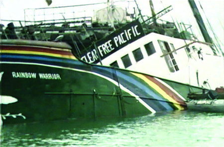 Image: The Rainbow Warrior partly submerged.