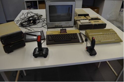 Image of computer and Atari gaming equipment.