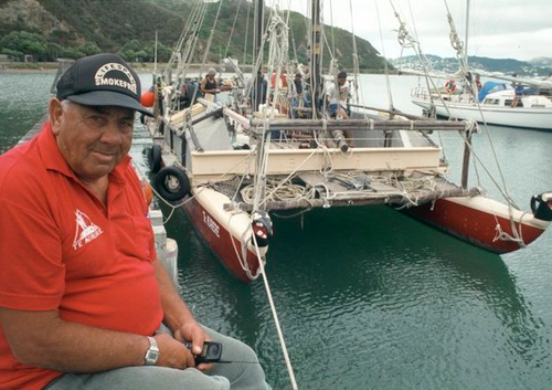 Sir Hekenukumai Busby with the twin-hulled waka Te Aurere, Shelley Bay, Wellington.