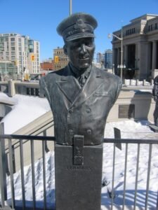 A statue of John Wallace Thomas on a sunny day outside in Ottawa, Canada.
