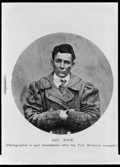 Mugshot of Amy Bock in men's clothing