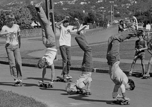 A group of boys skateboarding.