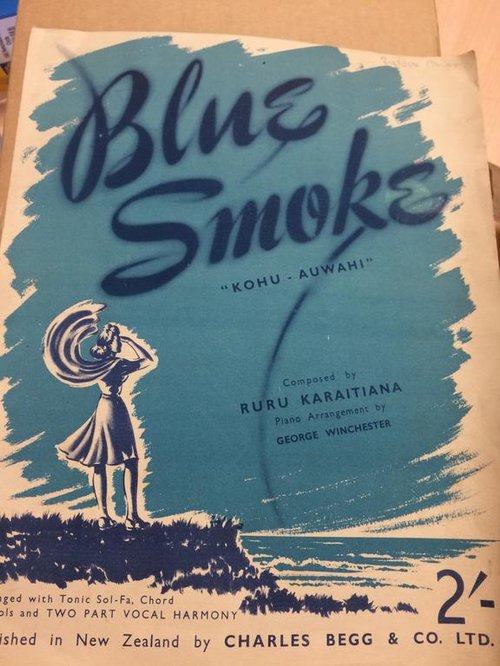 The cover of the 'Blue Smoke' sheet music depicts a young woman standing on a cliff looking out to sea.