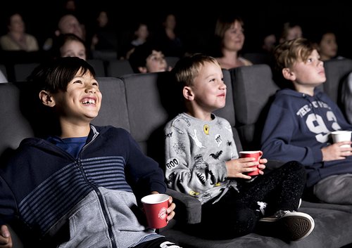 Kids watching a Ngā Taonga Cinema Screening.