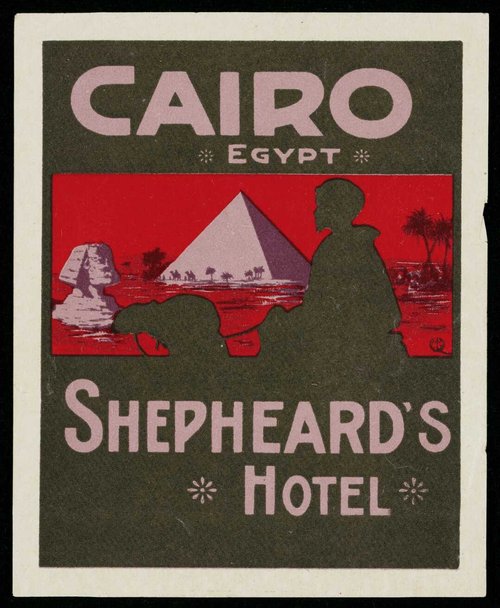 Luggage label with pyramid and silhouette of man on camel.