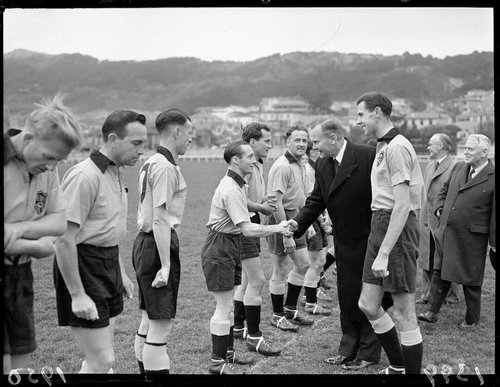 The Governor General and Prime Minister are shaking hands with the Auckland football team in 1950.