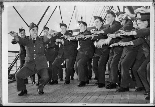 Men aboard a troop ship rehearsing a haka